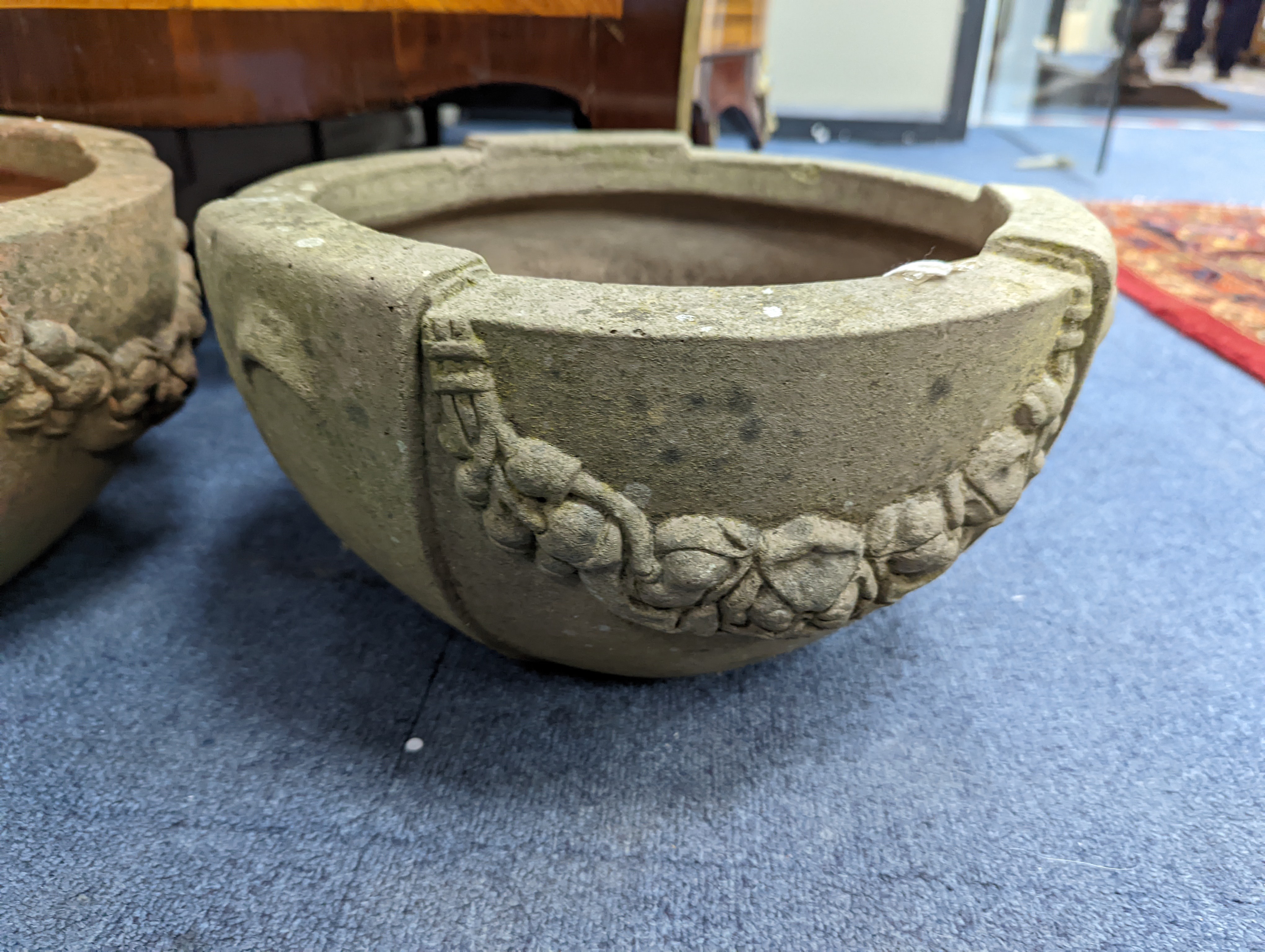 A pair of Compton terracotta poppy pattern planters, diameter 34cm, height 19cm